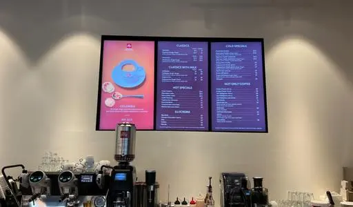 Menu boards at an Illy Caffè bar